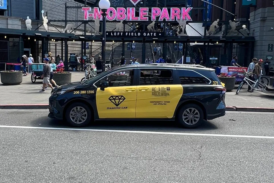 Cab 371 waiting at the kerb outside the T-Mobile Park left field gate.