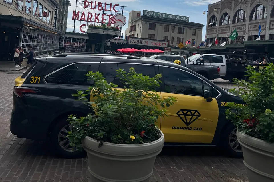 Cab 371 parked below the Pike Place Public Market sign.
